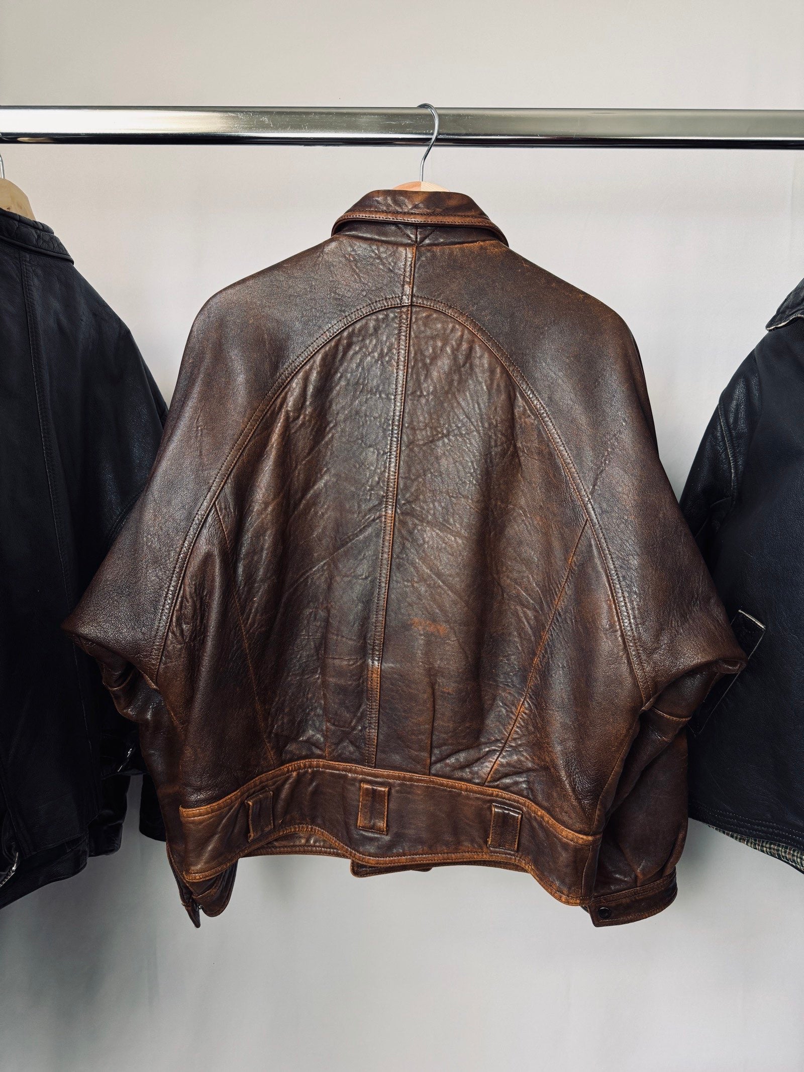 Heavy asymetric brown 90s leather jacket